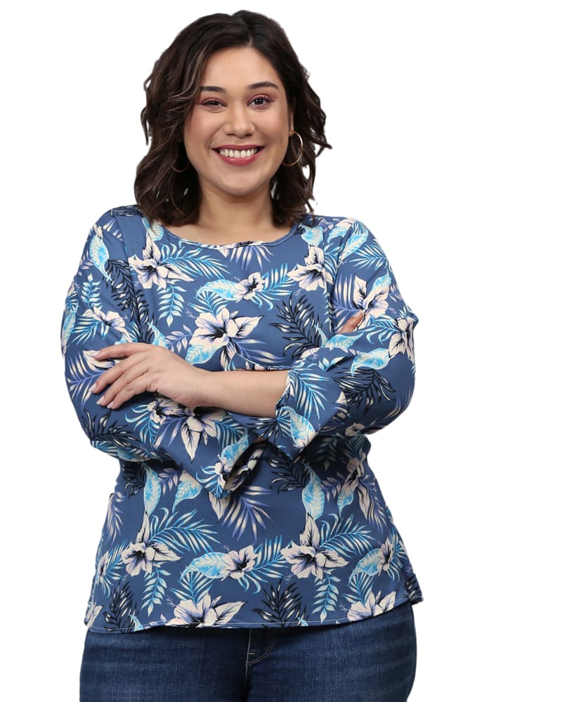Front of a model wearing a size 3XL Puff Sleeve Floral Top in Blue by Instafab Plus. | dia_product_style_image_id:298402